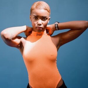Places + Faces P+F orange bodysuit. S. Never worn